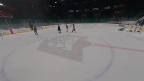 Camera swiftly moves above empty stands of ice arena Stock Footage 303278651