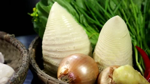 Camera swings from a basket of vegetables to washed goose Stock Footage 236558580
