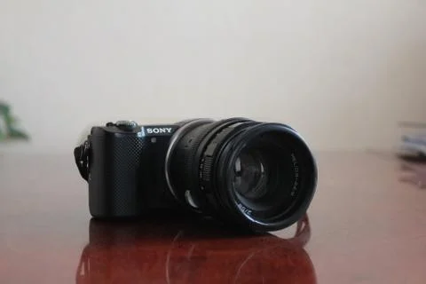 A camera on the table Stock Photos