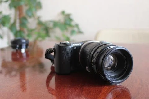 A camera on the table Stock Photos