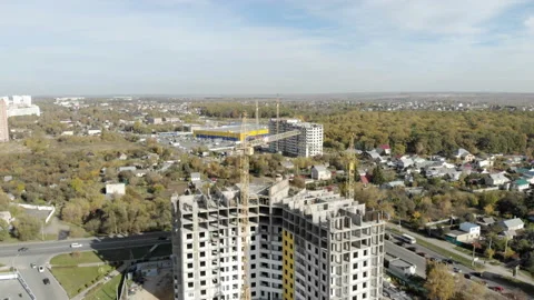 The camera takes off over the building under construction. Stock Footage 97122653