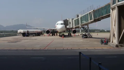The camera takes a plane and a passing car Stock Footage 120539919