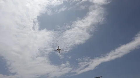 The camera takes a plane flying low Stock Footage 119726629