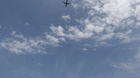 The camera takes a plane flying low Stock Footage 119726714