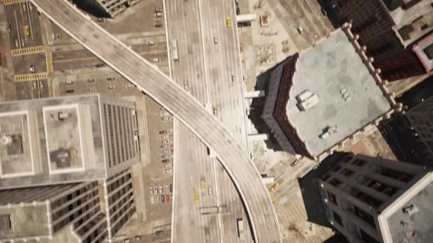 The camera takes off from the road and quickly rises up showing the busy road Stock Footage 266094694