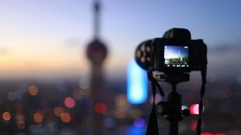 Camera taking photo in Shanghai sunset Stock Footage 79840722