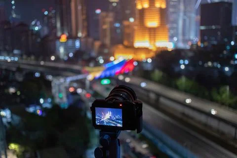 A camera taking a view of kuala lumpur city skyline at night Stock Photos