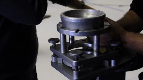 Camera team assistants prep crane or dolly camera head mount BTS Stock Footage 125635219