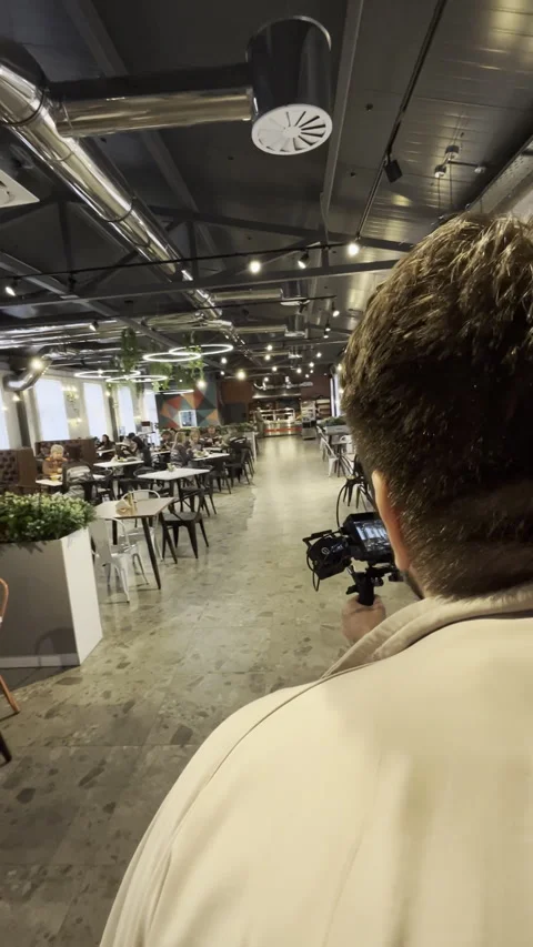 Camera team captures beautifully decorated loft restaurant Stock Footage 313865968