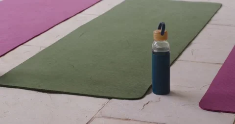 Camera is tightening frame and panning right, making blue-sleeved bottle appear Stock Footage 339231162