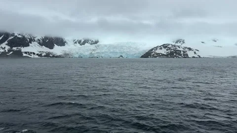 Camera Tilt Up From Cruise Ship Deck to Reveal Antarctica Moody Weather Gla.. Stock Footage 336926013