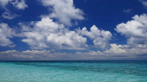 Camera tilt down of the beautiful tropical sea and deepl blue skies in UHD Stock-Footage 62834700