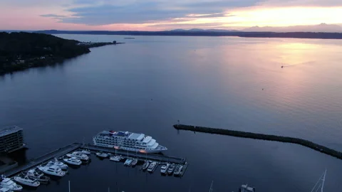 Camera tilt from harbor to reveal sunset Stock Footage 169540918