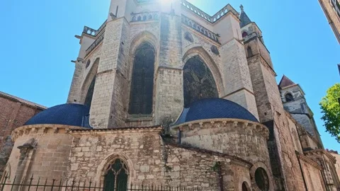 Camera tilting up and panning across Cathédrale Saint-Etienne in Cahors Stock Footage 346076045