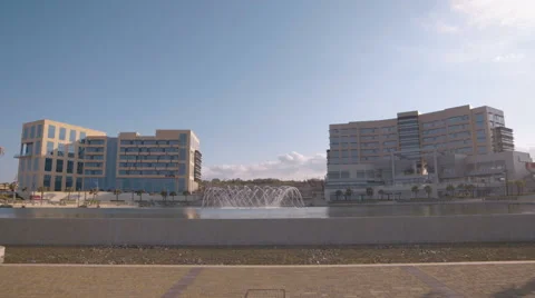 Camera tilting down over a business center in Malta Stock Footage 65316247