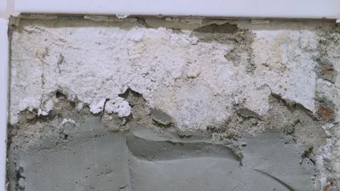 Camera tilting down showing missing tiles and faucet in the bathroom Video stock 117303171