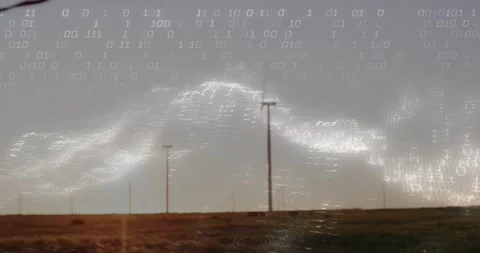 Camera tilting downward wire fading binary code merging with waves around poles Stock Footage 317154623
