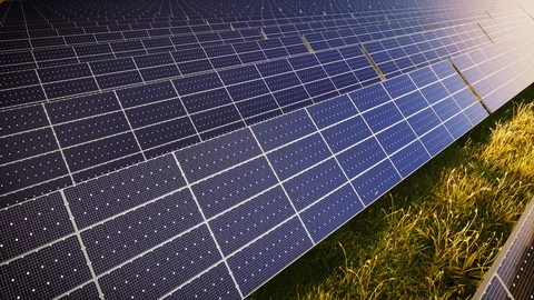 Camera Tilting Green Energy Solar Panel Farm At Sunset 動画素材 129018084