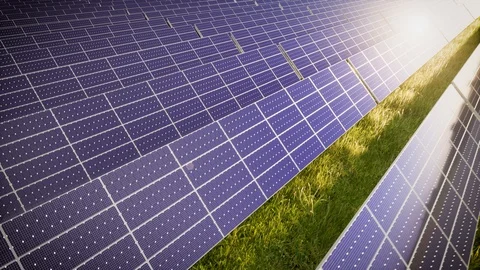 Camera Tilting Over Solar Panel Farm At Green Energy 動画素材 128813383