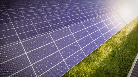 Camera Tilting Over Solar Panel Farm At Green Energy 動画素材 128844595