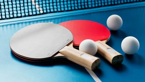 The camera is tilting up the table tennis set. Ping pong balls, paddles and net. Video stock 133452691