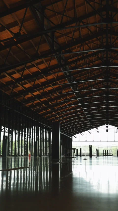 Camera tilting upwards revealing huge empty structure Stock Footage 291498105