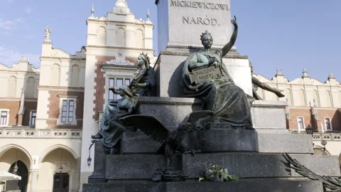 Camera tilts up the Adam Mickiewicz Monument Stock Footage 271334497
