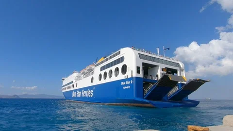 Camera tilts up from departing car ferry to the blue sky Stock Footage 92133226