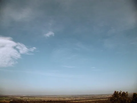 Camera tilts down from the clouds on a mountain. Stock Footage 80242967