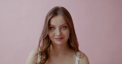 Camera tilts down from face of caucasian woman to her pregnant belly. 4K RAW gra Stock Footage 113072618