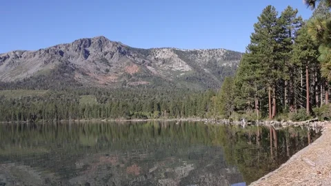 Camera Tilts Down on Fallen Leaf Lake near South Lake Tahoe California Stock Footage 245532541
