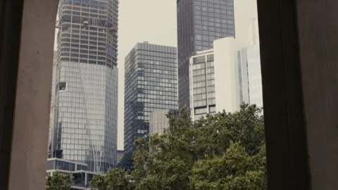 Camera tilts down Frankfurt skyline Stock Footage 252593663