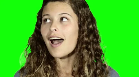 Camera tilts down to reveal beautiful amazed girl looking up and around Stock Footage 54307630