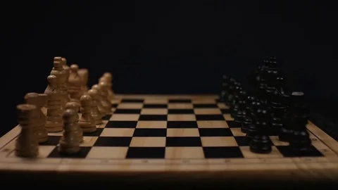 Camera tilts down to reveal a chess board with all the pieces lined up to start Stock Footage 76683759