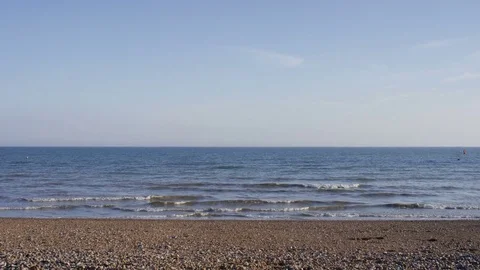 Camera tilts down to reveal the sea and shoreline Stock Footage 75825147