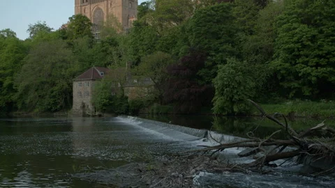 Camera tilts down to River Wear from Durham Cathedral Stock Footage 246917594