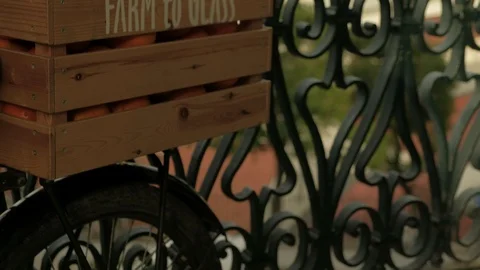 Camera tilts up to oranges and lemons in a wooden crate Stock Footage 118372192