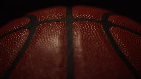 Camera tilts up revealing a close up shot of symmetrical pattern on a basketball Stock-Footage 135592144