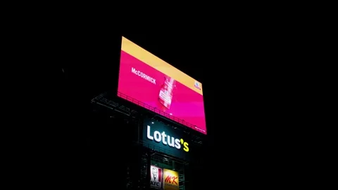 Camera tilts revealing a LED Billboard of Lotus's with KFC and MK plus the Stock Footage 256147216