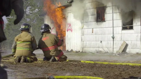 Camera tilts up revealing two firemen Stock Footage 60982851