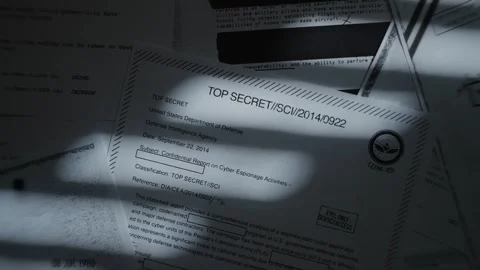 Camera top shot spin over censored top secret government documents and files Stock Footage 316317675