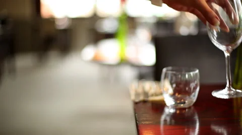 Camera Track Towards Person Placing Wine Glasses on Dining  Table Stock Footage 44085448