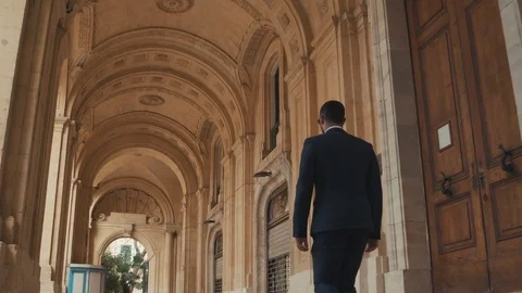 Camera tracking in - Business man walking in a tunnel Stock Footage 74502007