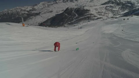 Camera tracking red skier from right side Video stock 346056208