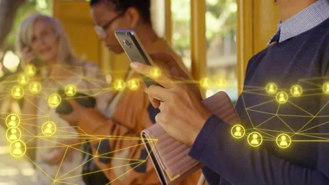 Camera tracking right, right commuter scrolling and tapping phone, network nodes Stock Footage 333396770