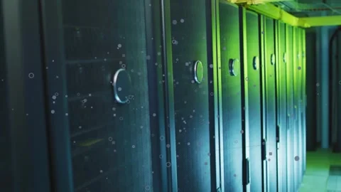 Camera tracking slowly through data center, revealing server racks with floating Stock Footage 333830294