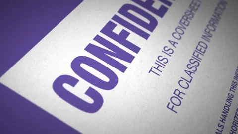 Camera tracks across the coversheet 'Confidential' document Stockbeeldmateriaal 237431327
