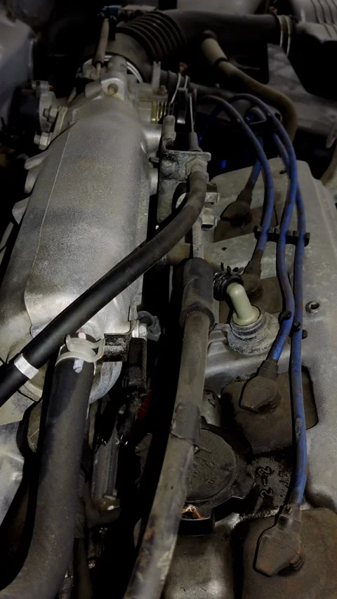 Camera tracks along complex hoses and wires on car engine Stock Footage 335835113