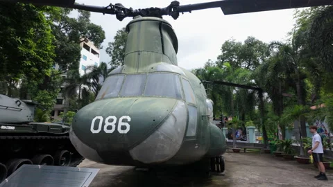 Camera tracks around US Chinook helicopter at War Remnants Museum, Ho Chi Minh Stock Footage 307833248