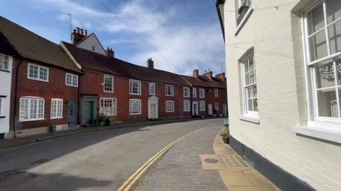 Camera tracks down historic Fishpool street in St Albans on a sunny Spring day 스톡 동영상 151450550